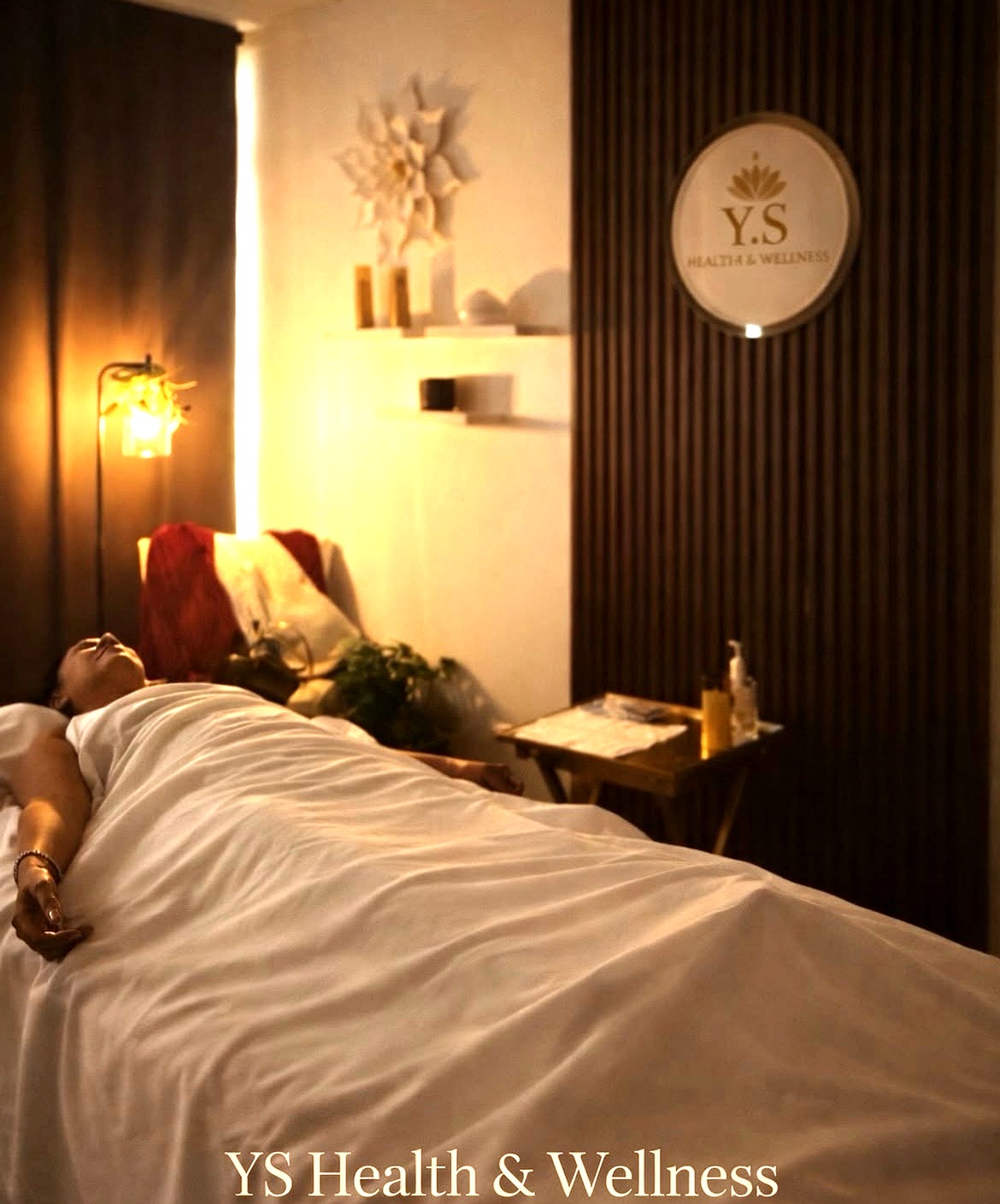 Client resting on massage table at Y.S Health and Wellness